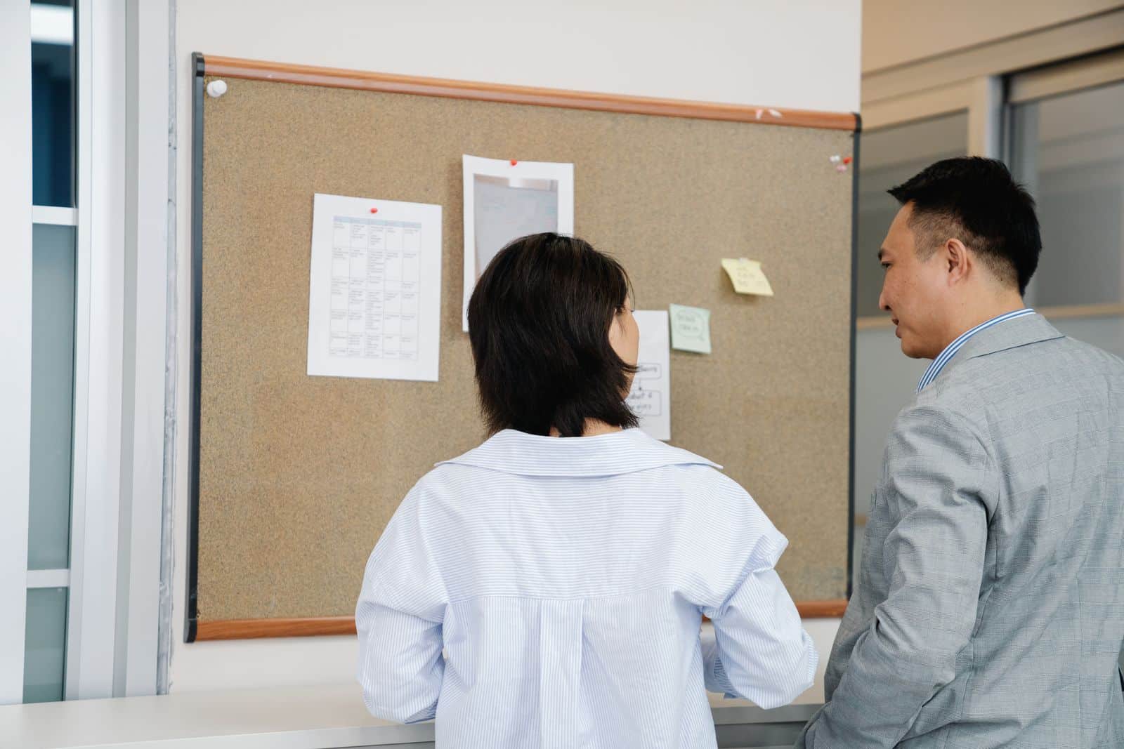 Board members and a community manager reviewing information together